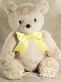 Handmade teddy bear with a yellow ribbon