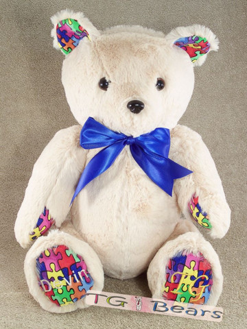 Logan Bear with autism puzzle piece accents